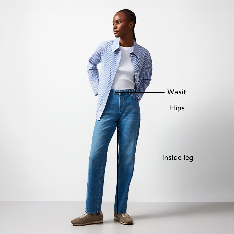 Person wearing a black-and-white striped top and high-waisted blue jeans, with labels indicating waist, hips, and inside leg measurements.